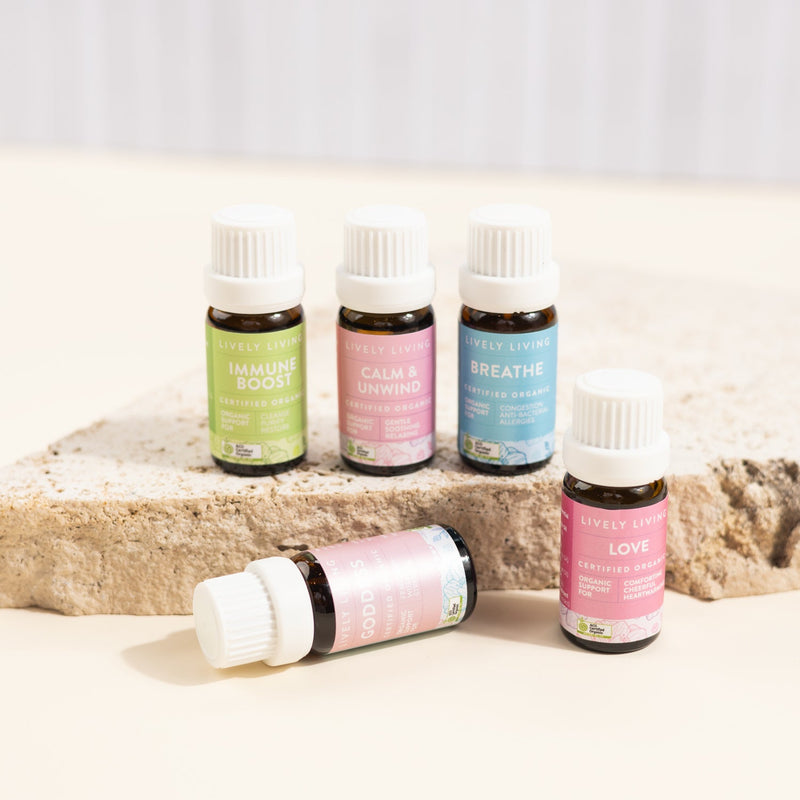 Set of essential oil bottles on a light surface with a neutral background