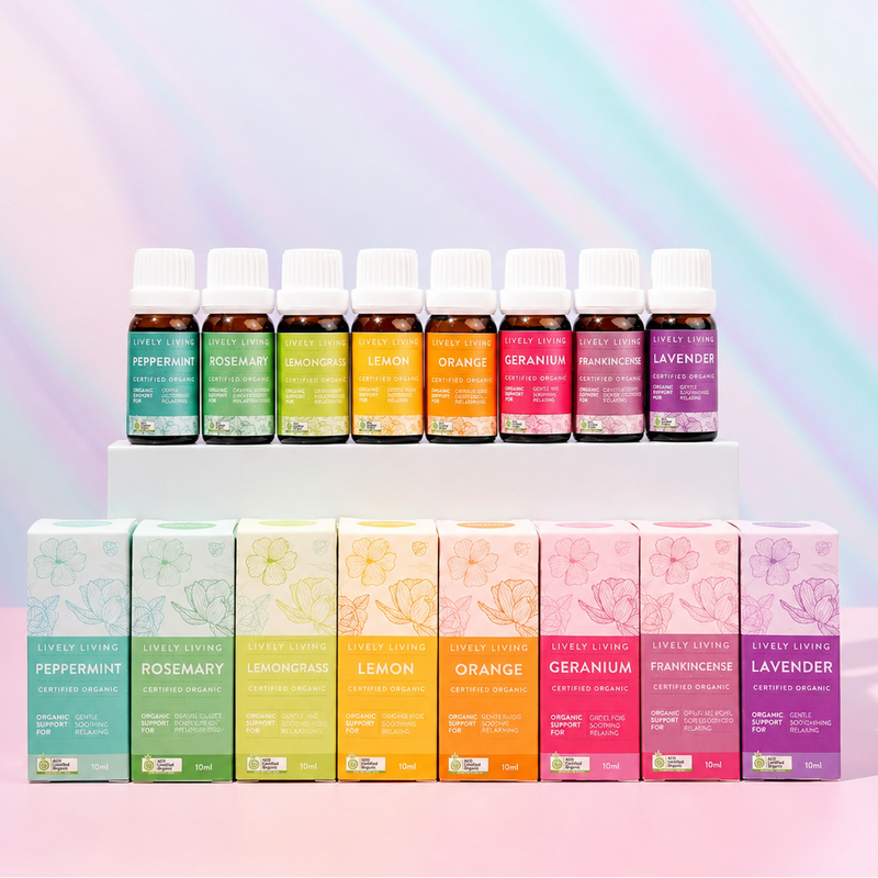 Set of essential oil bottles and boxes on a pastel rainbow background