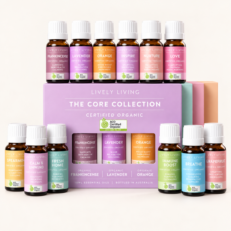 The Core Collection gift box surrounded by twelve Lively Living certified organic essential oils on a cream background