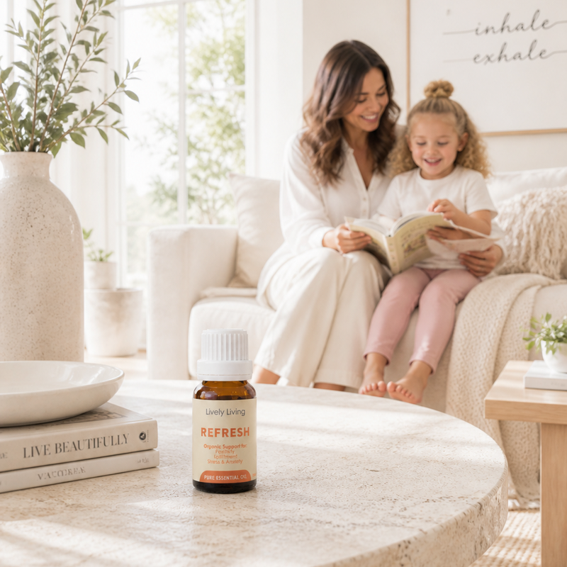 Woman and child reading a book together in a cozy living room with a bottle of 'Nufresh' on a table.