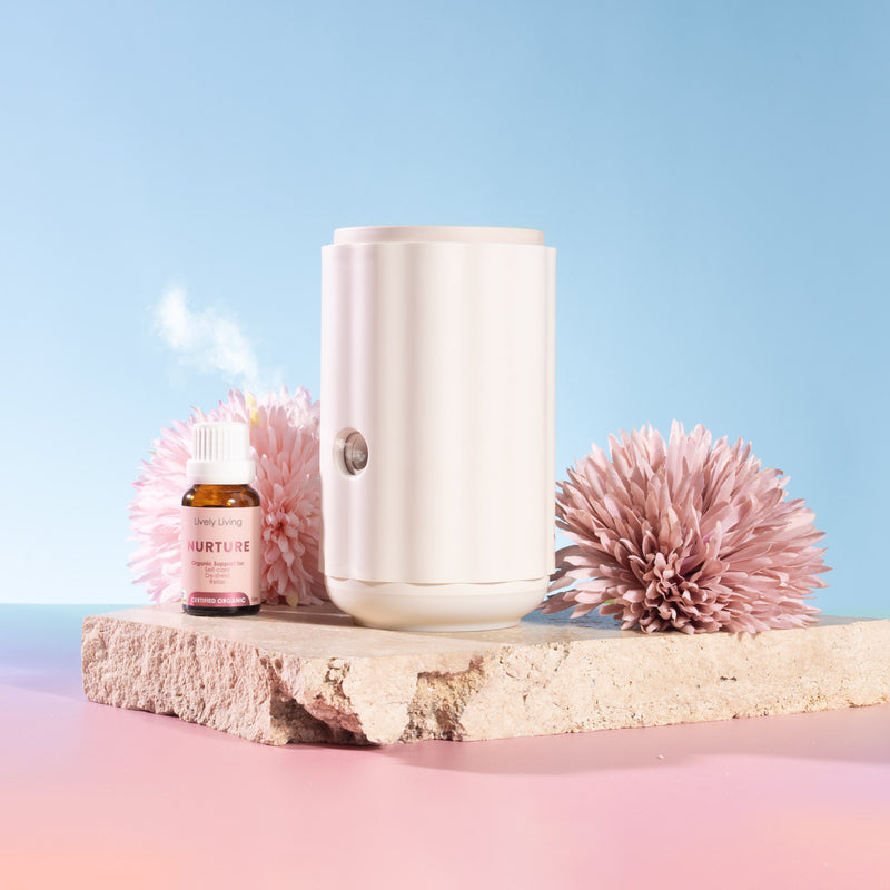 Aroma-Ascension Waterless diffuser. White diffuser with pink flowers