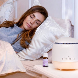 Woman sleeping beside the Aroma-Frequency Sound Diffuser