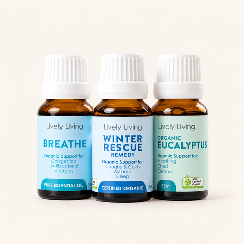 Three Lively Living 15ml oils, Breathe, Winter Rescue Remedy and Organic Eucalyptus, side by side on a cream background