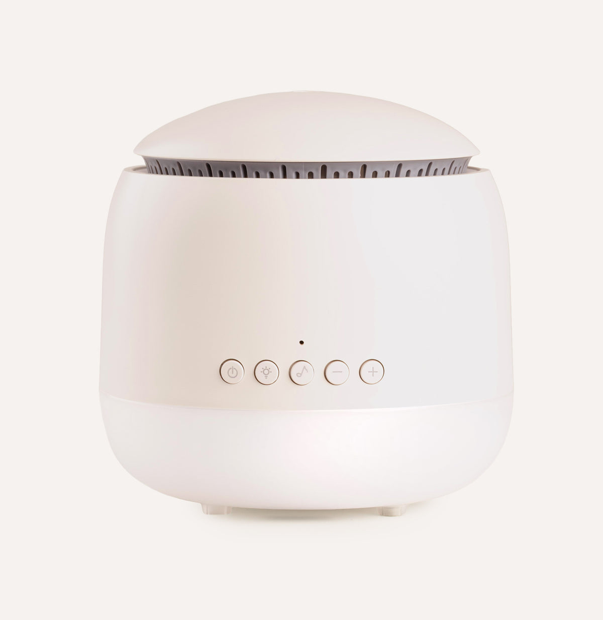 White diffuser with control buttons on a light beige background