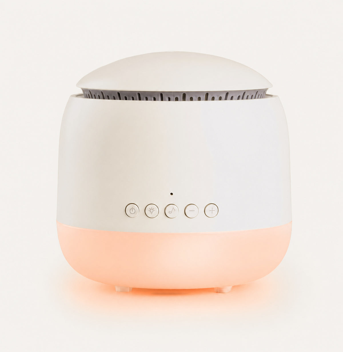 White and pink device with buttons on a light gray background