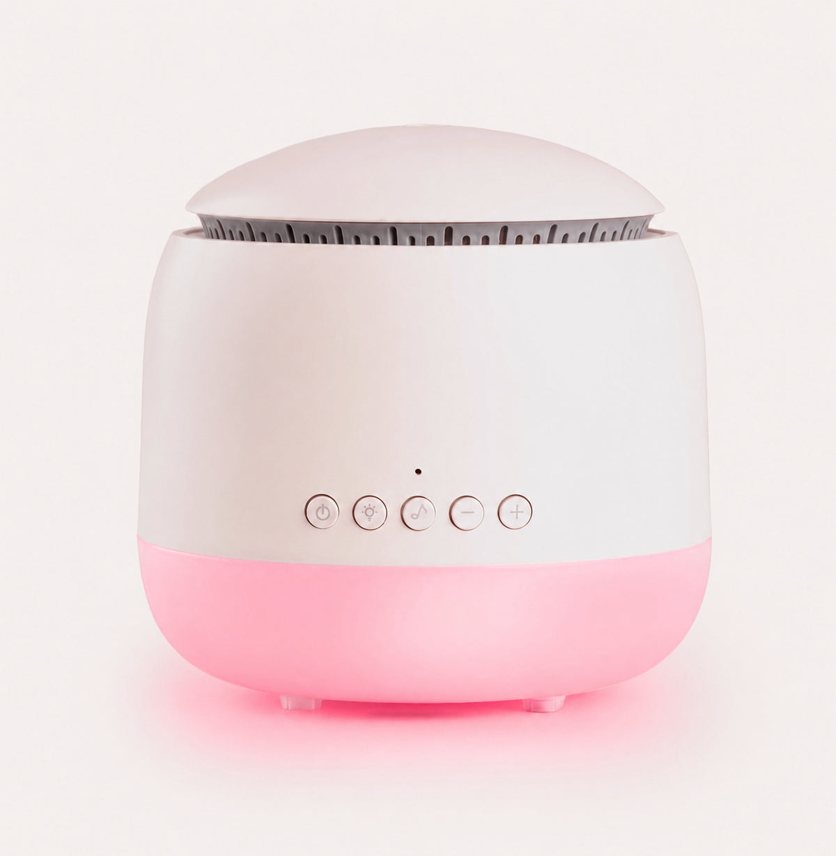 White and pink device with buttons on a light pink background