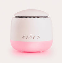 White and pink device with buttons on a light pink background