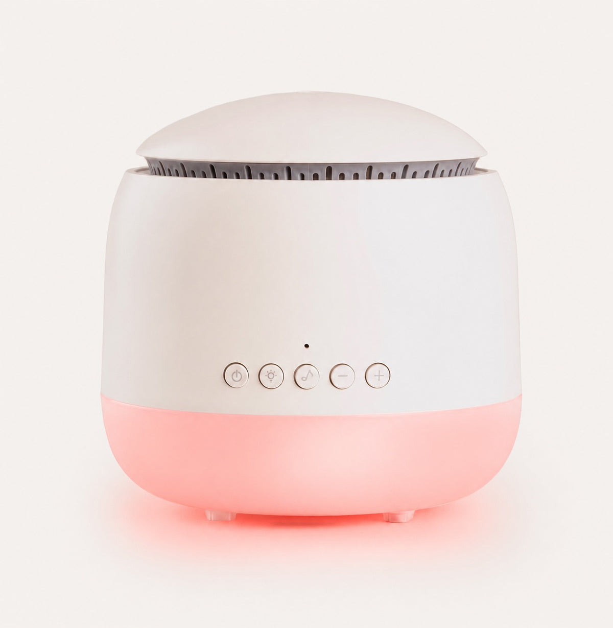 White and pink device with control buttons on a light gray background
