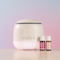 Stone coloured round diffuser and 2 oil bottles 