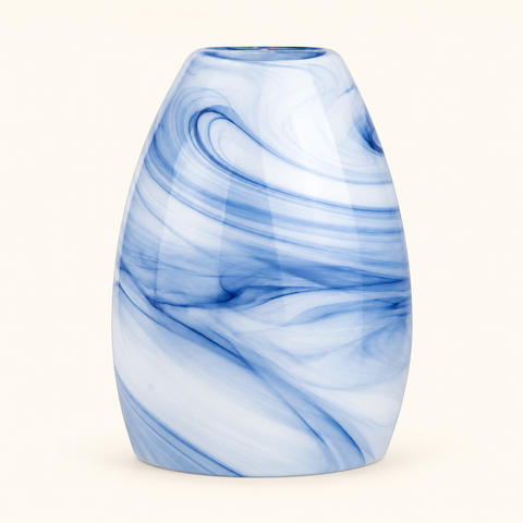Replacement diffuser glass lid in denim blue with a white marbled swirl pattern on a cream background