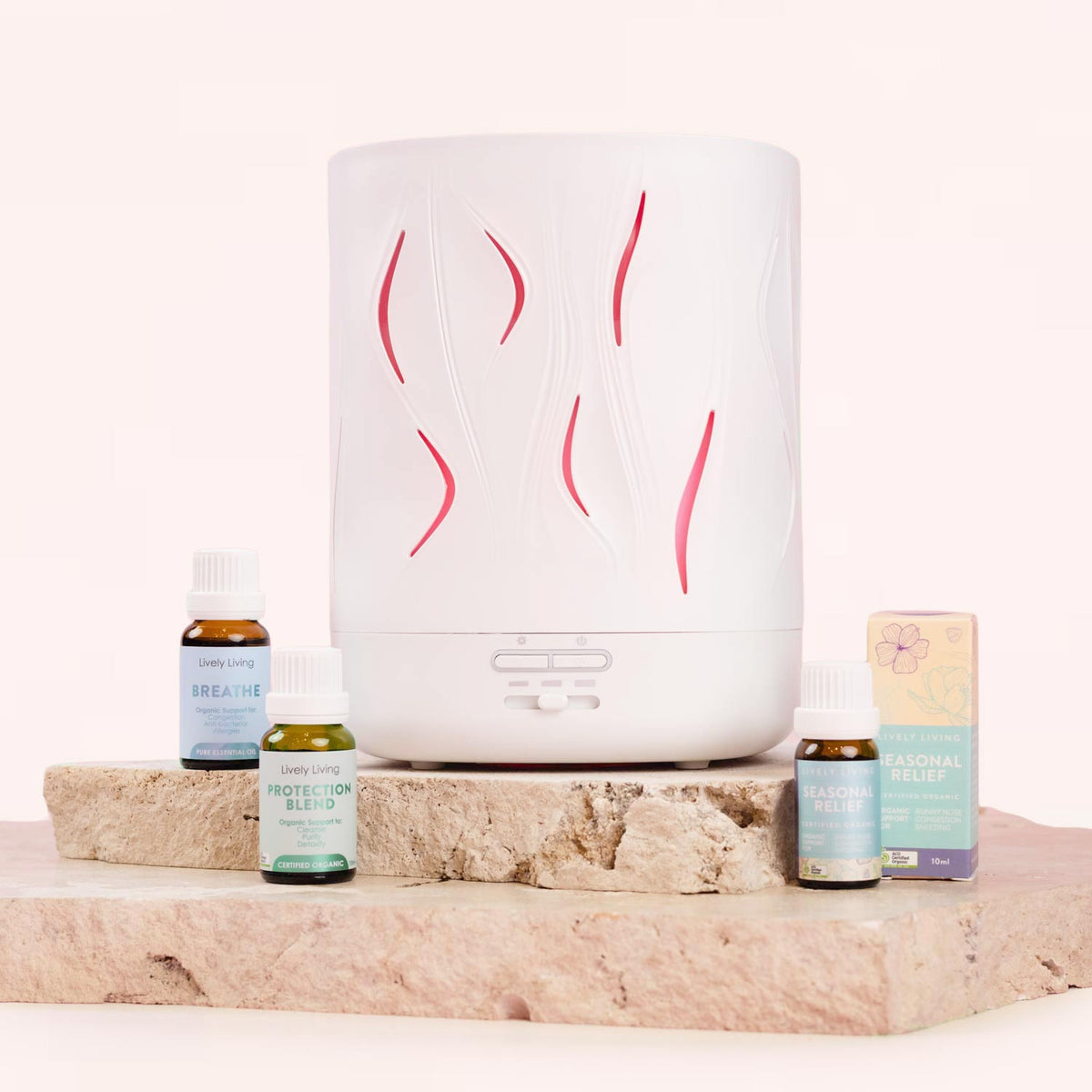 White diffuser with decorative lines on a stone surface with essential oil - Lively Living 