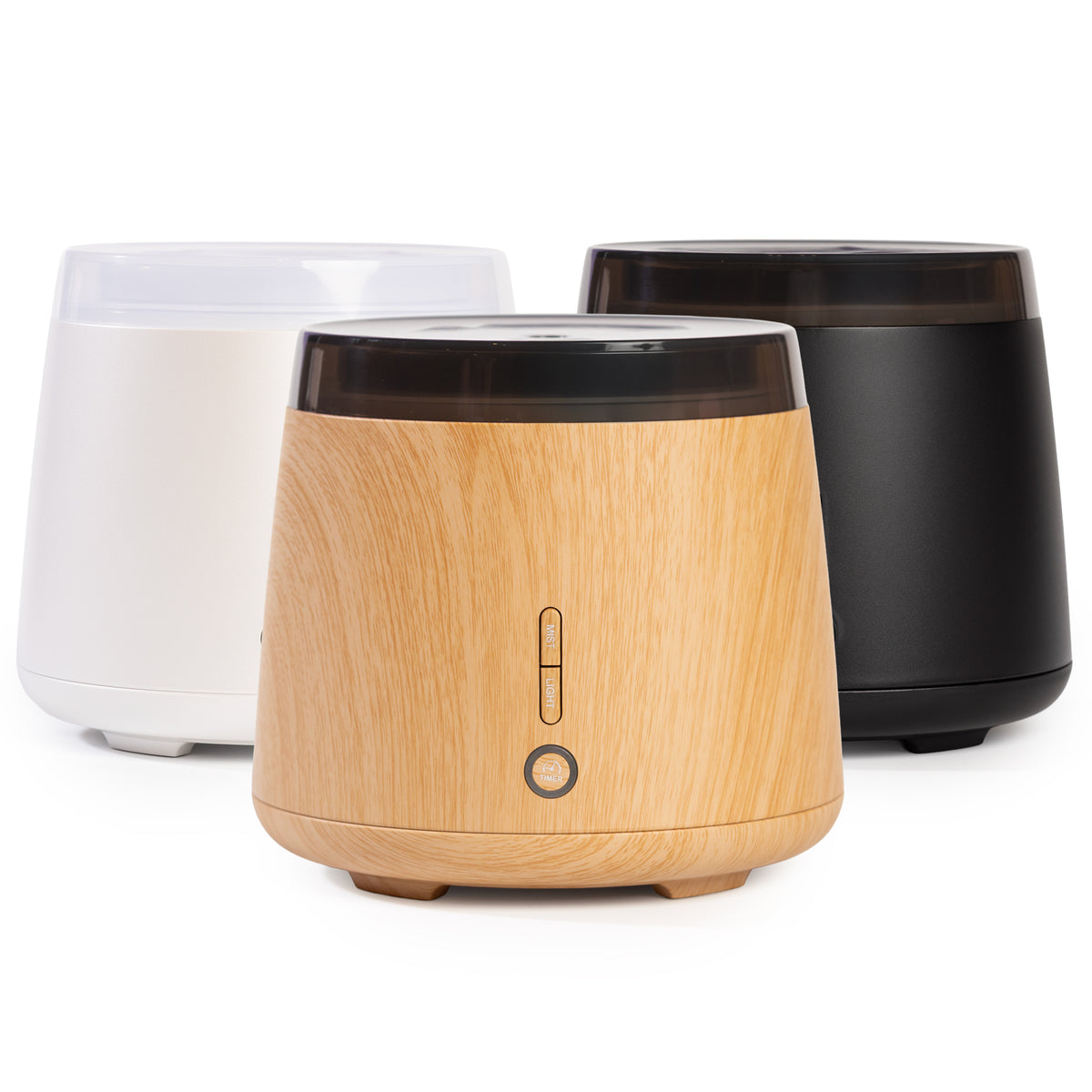 Three diffusers in white, black, and wooden finish on a white background