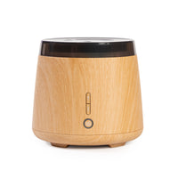 Wooden diffuser with black top on a white background