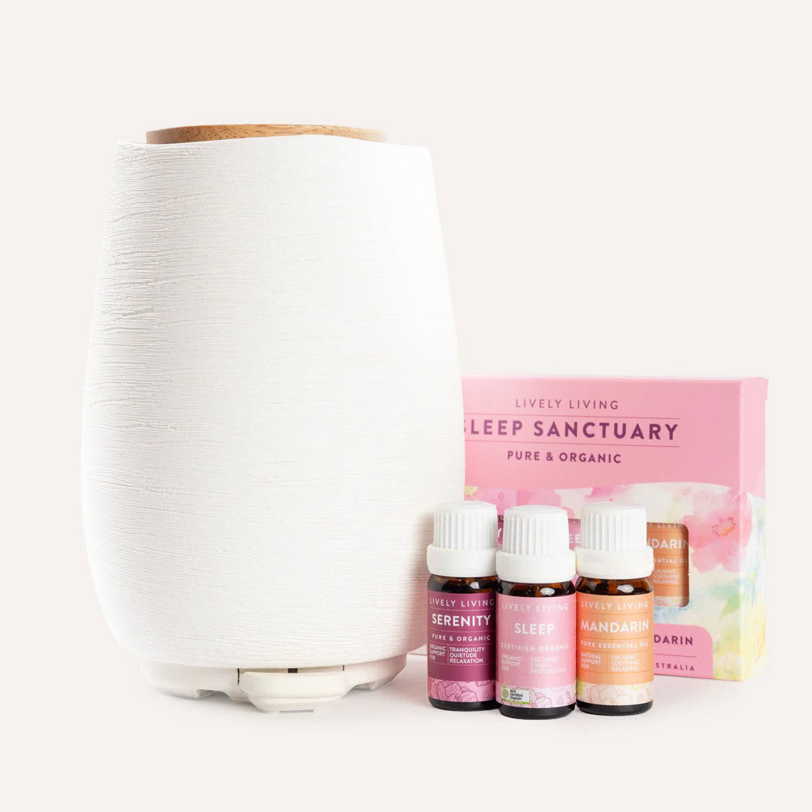 White diffuser with essential oil bottles and packaging on a white background