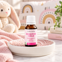 Sensitive Child essential oil on a pink patterned dish in a child's bedroom with a toy bunny
