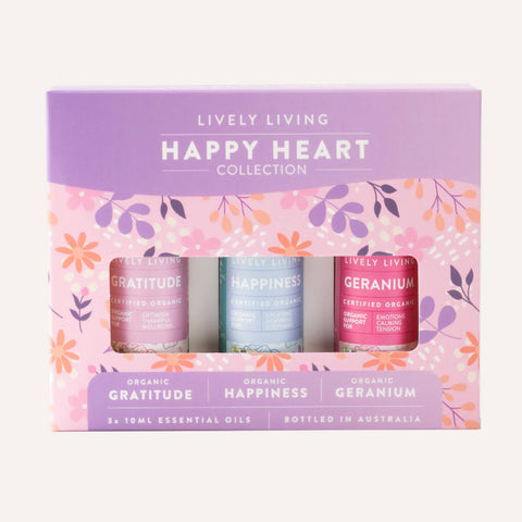 Lively Living Happy Heart Collection with three essential oil bottles on a floral background