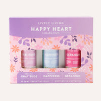 Lively Living Happy Heart Collection with three essential oil bottles on a floral background