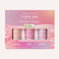 Lively Living essential oil set with three bottles labeled 'Nurture', 'Love', and 'Inspire' on a pink and purple gradient background.