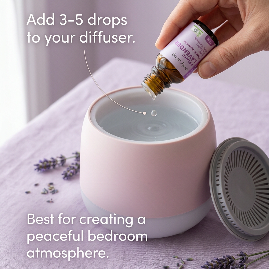 Hand adding drops of Lively Living Organic Lavender oil to a pale pink diffuser on a lilac tablecloth with dried lavender, with the text Add 3-5 drops to your diffuser