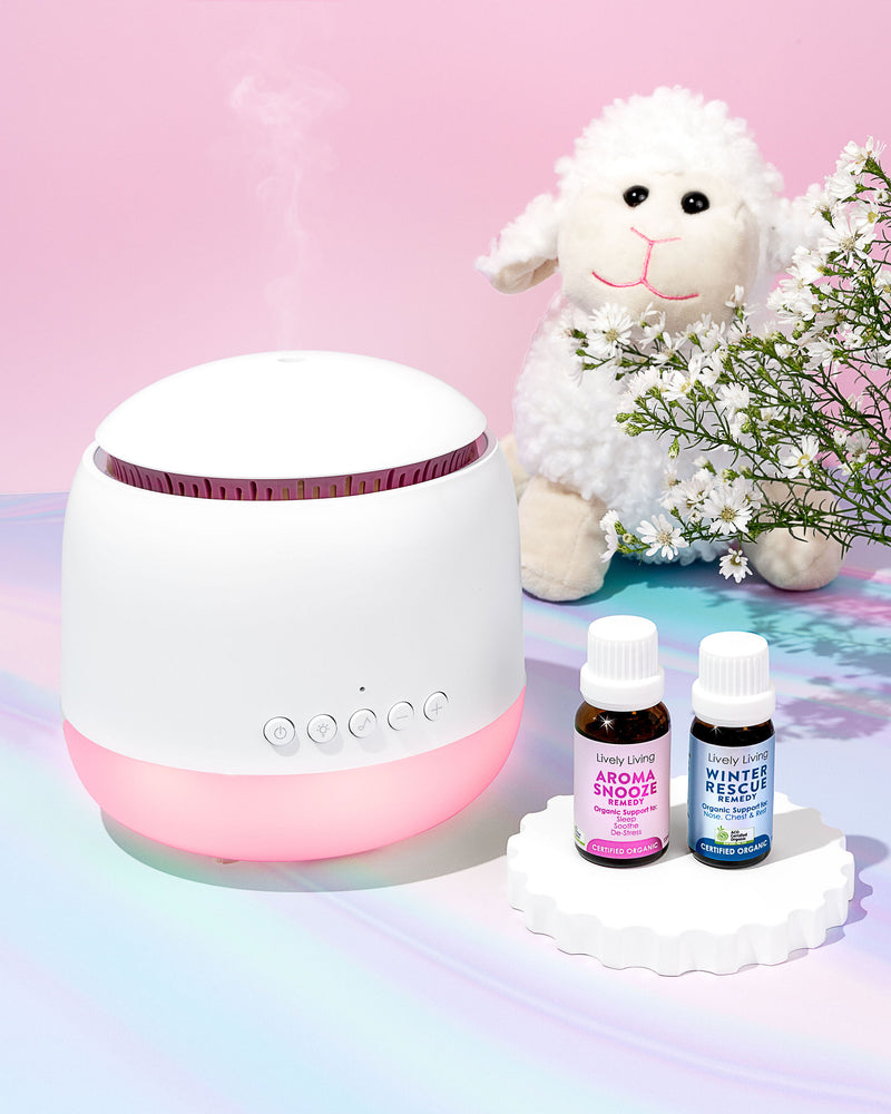 White diffuser with bottles and a toy sheep on a colorful background