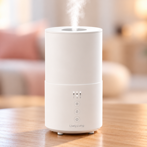 White Lively Living Safe Air Purifier with touch controls releasing mist on a timber table, with a soft pink lounge room behind