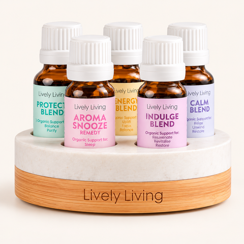 Five Lively Living 15ml blends, Protect, Aroma Snooze, Energy, Indulge and Calm, in a round marble and timber oil stand