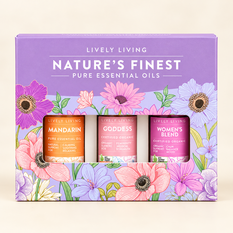Lively Living Nature's Finest gift box holding Mandarin, Goddess and Women's Blend essential oils, on a cream background