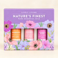 Lively Living Nature's Finest gift box holding Mandarin, Goddess and Women's Blend essential oils, on a cream background
