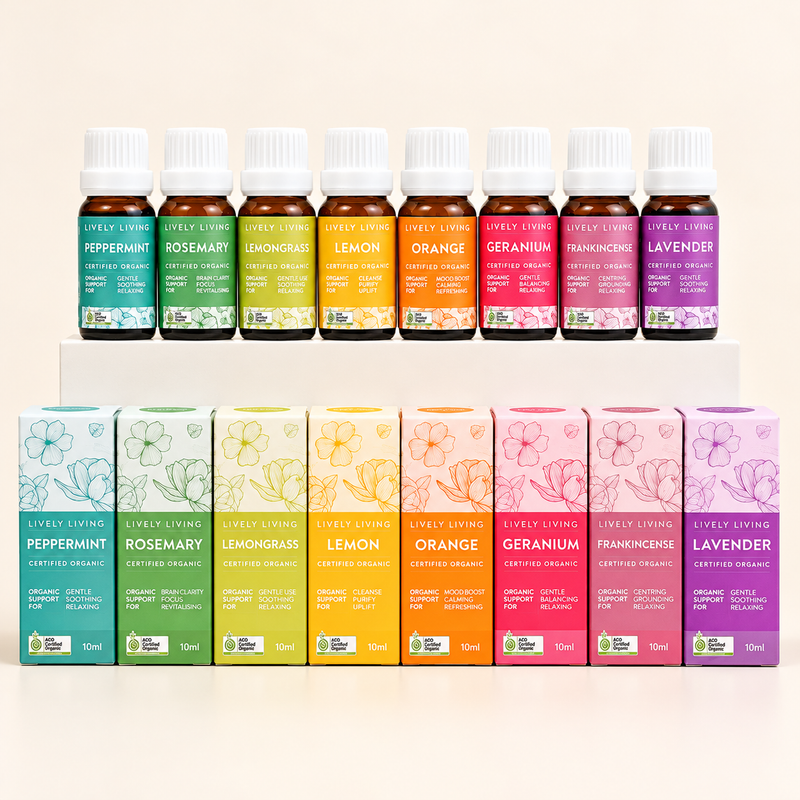 Eight Lively Living certified organic single oils, Peppermint, Rosemary, Lemongrass, Lemon, Orange, Geranium, Frankincense and Lavender, with their matching boxes lined up below