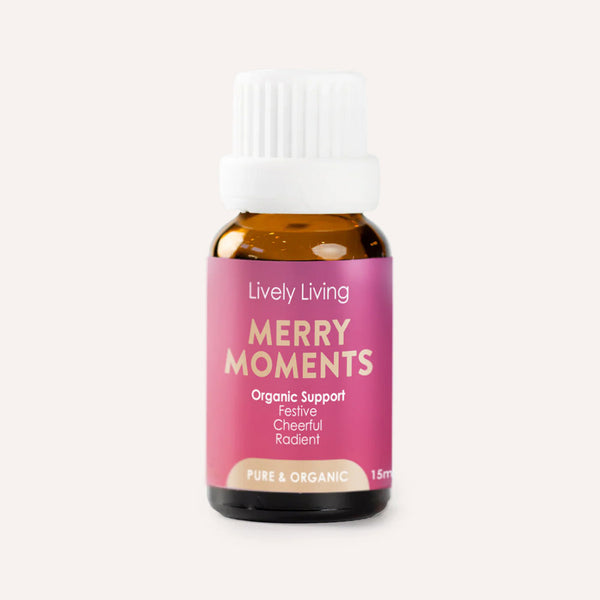 Bottle of Lively Living Merry Moments essential oil on a white background