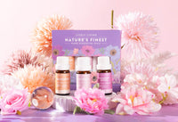 Lively Living of Mothers day essential oil trio pack with pink and orange flowers surrounding it