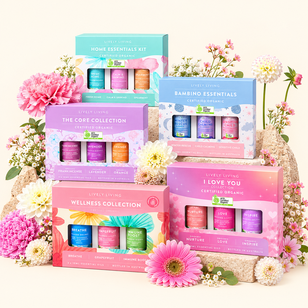 Lively Living gift sets stacked with fresh flowers: Home Essentials Kit, Bambino Essentials, The Core Collection, Wellness Collection and I Love You Collection
