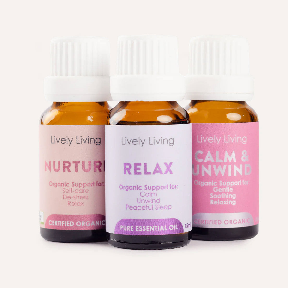 Three bottles of Lively Living essential oils labeled 'Nurture', 'Relax', and 'Calm & Unwind' on a white background.