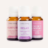 Three bottles of Lively Living essential oils labeled 'Nurture', 'Relax', and 'Calm & Unwind' on a white background.