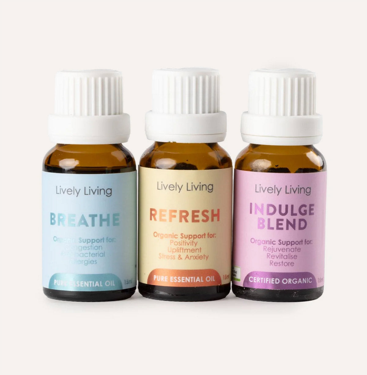 Three bottles of Lively Living essential oils on a white background