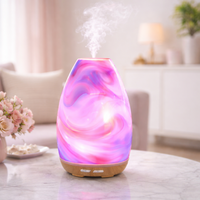 Marbled patterned diffuser on a table with a blurred living room background