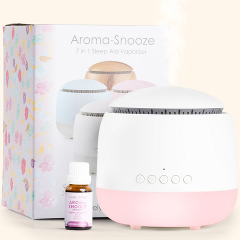 Aroma-Snooze 7-in-1 Sleep Aid Vaporizer with packaging and essential oil bottle on a light background