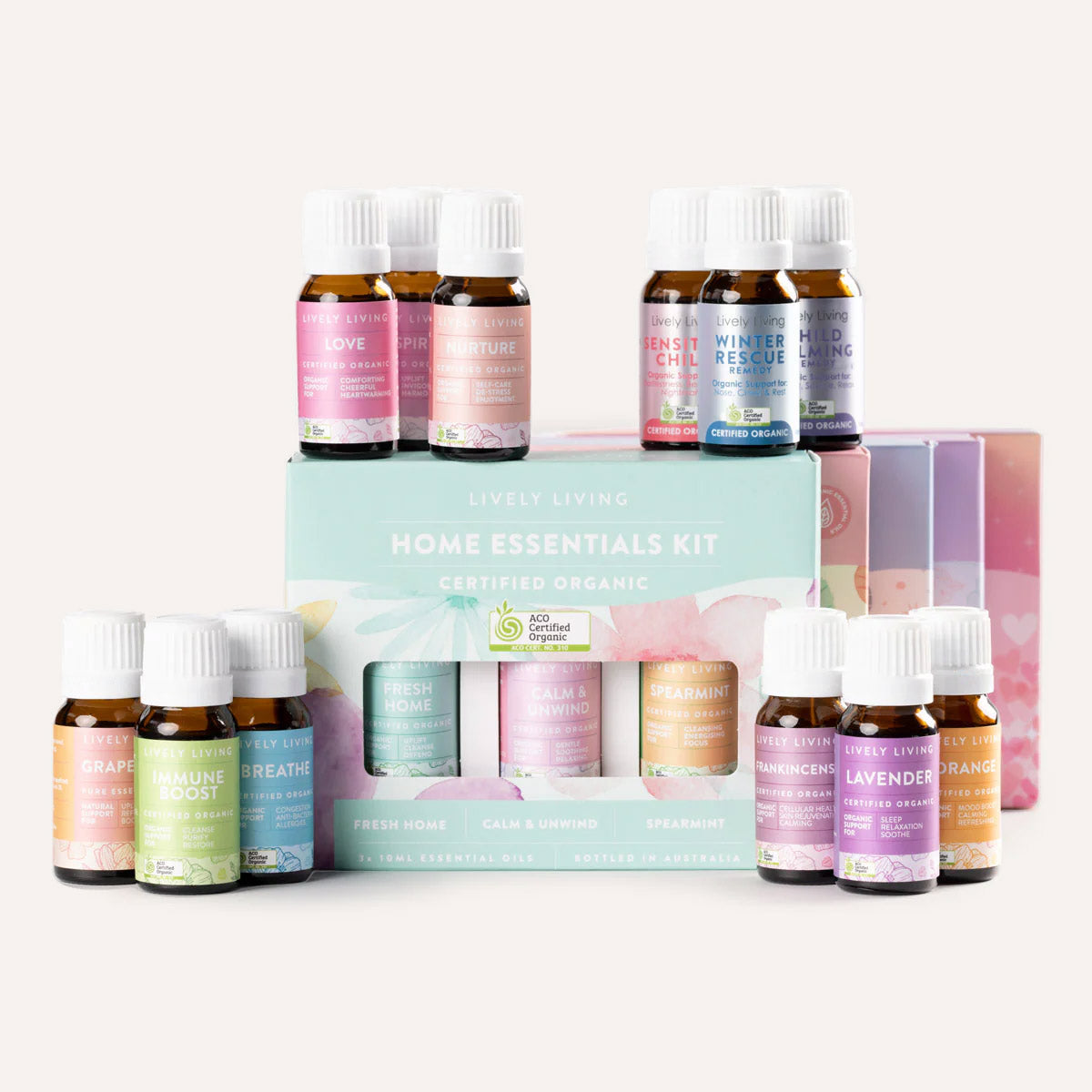 Set of essential oil bottles with a branded box on a white background