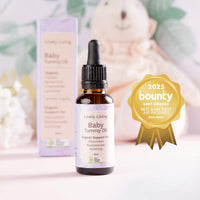 Baby essential oil bottle with packaging and a 2025 Bounty Baby Award on a light background. Lively living 
