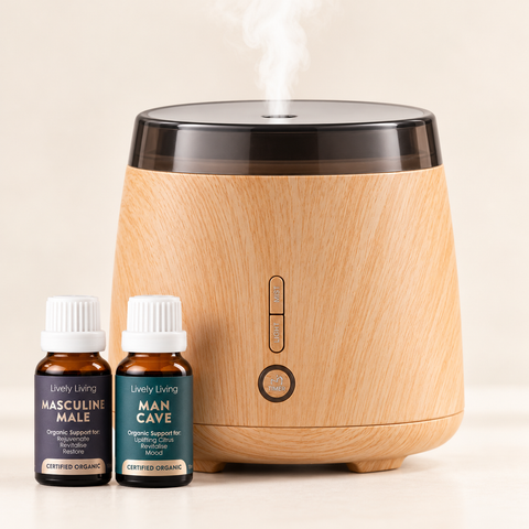 Aroma-Elm woodgrain diffuser releasing mist beside Masculine Male and Man Cave certified organic 15ml oils on a cream background