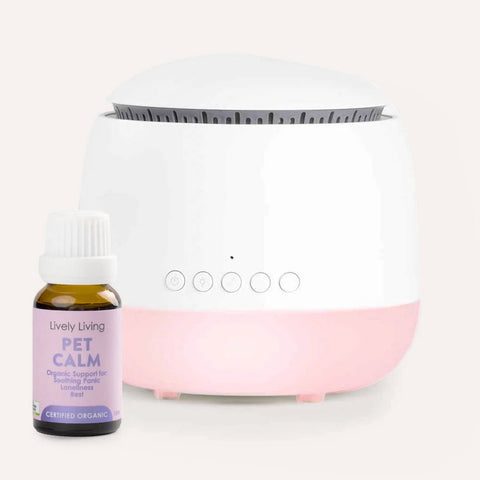 White diffuser with pink base and a bottle labeled 'Pet Calm' on a white background