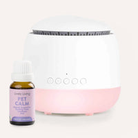 White diffuser with pink base and a bottle labeled 'Pet Calm' on a white background