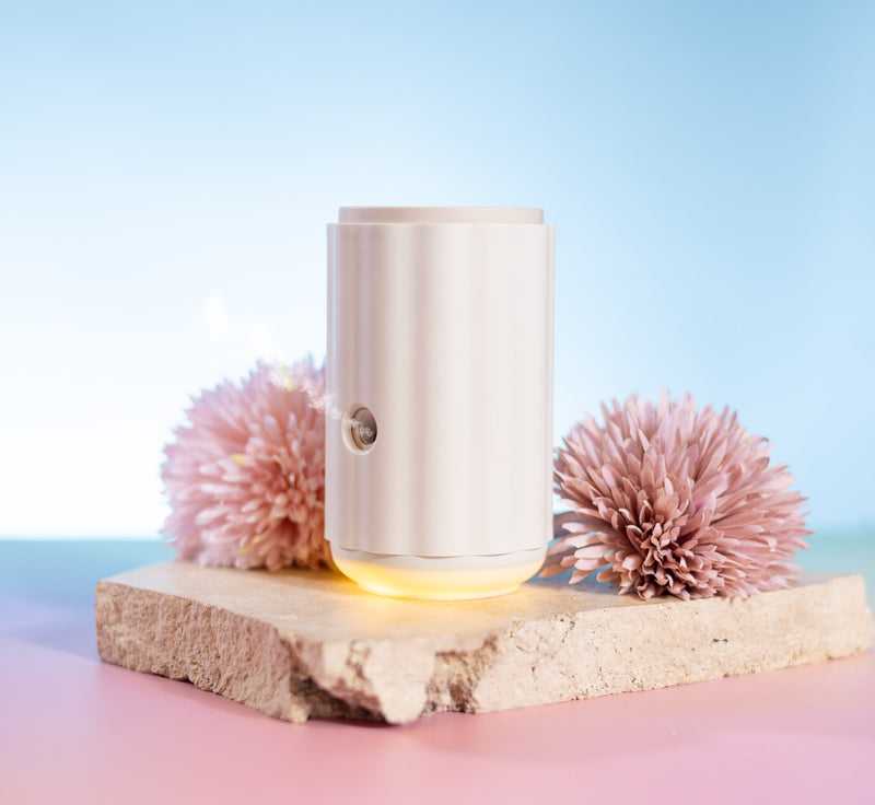 Aroma-Ascension Waterless diffuser. Small cylindrical light on a wooden 