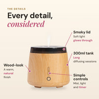 Aroma-Elm diffuser details: smoky lid that lets soft light glow through, 300ml tank, wood-look finish, and simple controls for mist, light and timer