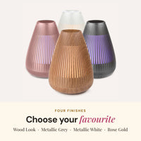 Aroma-Flare Diffuser in four finishes: wood look, metallic grey, metallic white and rose gold