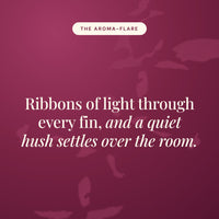 Aroma-Flare statement card in burgundy reading Ribbons of light through every fin, and a quiet hush settles over the room.