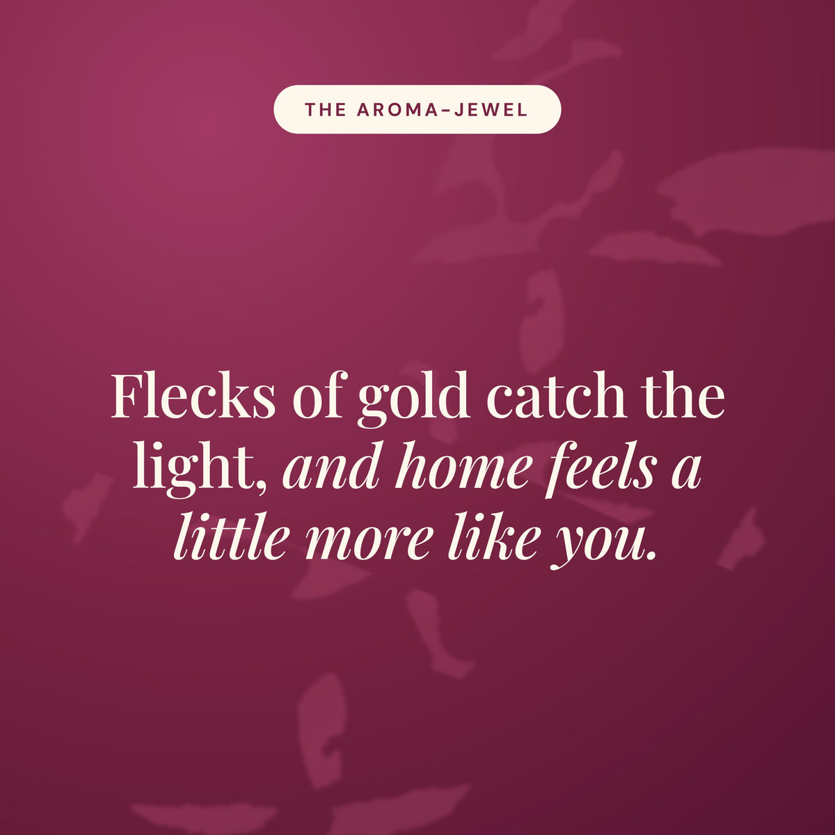 Aroma-Jewel statement card in burgundy reading Flecks of gold catch the light, and home feels a little more like you.