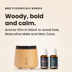 Aroma-Elm woodgrain diffuser releasing mist beside Masculine Male and Man Cave certified organic 15ml oils on a cream background