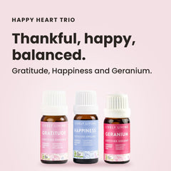 Lively Living Happy Heart Collection with three essential oil bottles on a floral background