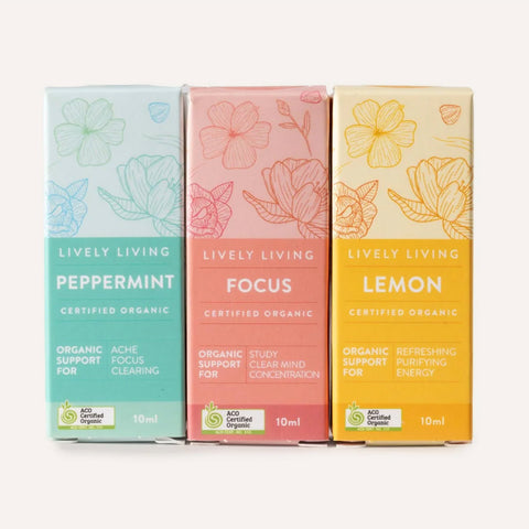 Three boxes of Lively Living tea on a white background